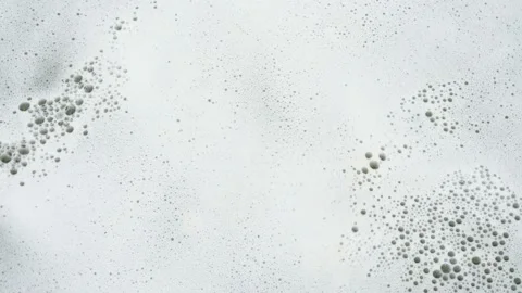 Close-up of soap foam with bubbles on the water surface. 4K. Video stock 111419995