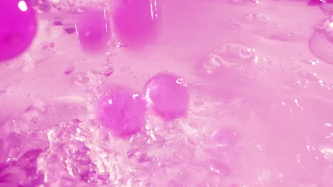 Close-up soap foam texture with pink gel balls, white shampoo soapsud background Stock Footage 308513261