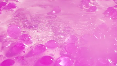 Close-up soap foam texture with pink gel balls, white shampoo soapsud background Stock Footage 312311962