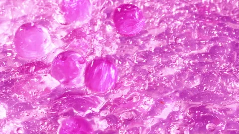 Close-up soap foam texture with pink gel balls, white shampoo soapsud background Stock Footage 319624617