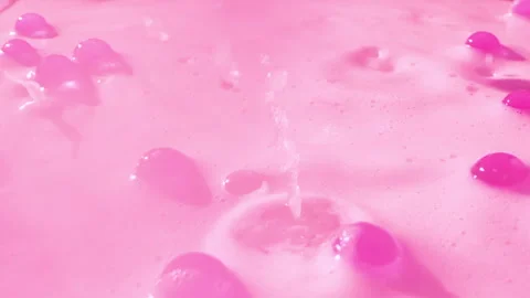 Close-up soap foam texture with pink gel balls, white shampoo soapsud background Stock Footage 320096943