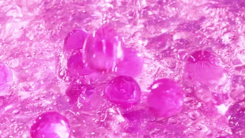 Close-up soap foam texture with pink gel balls, white shampoo soapsud background Stock Footage 321791558