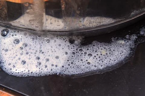 Close-up of soapy bubbles and foam on a dark surface, abstract texture Stock Photos