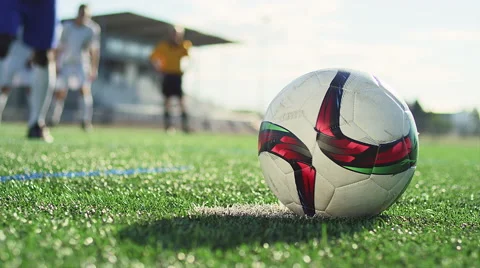 Close up of a soccer ball being kicked by a player in slow motion Stock Footage 56141572