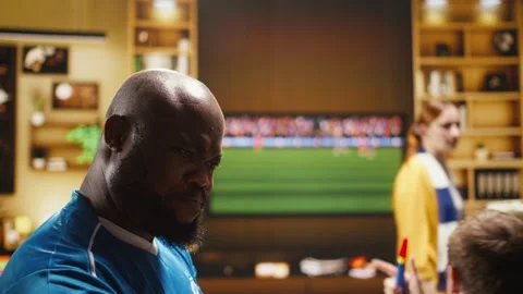 Close up of soccer fan at home drinking beer, reacting to negative results Stock Footage 338176980