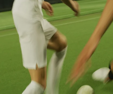 Close up of soccer player practising and falling on ground, stadium at night Stock Footage 147060499