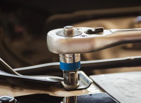 Close up of a socket or torque wrench tightening a nut. Stock Photos