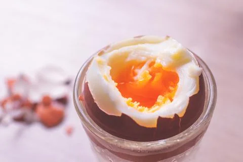 Close-up of a soft-boiled chicken egg for breakfast in an egg glass cup. Stock Photos