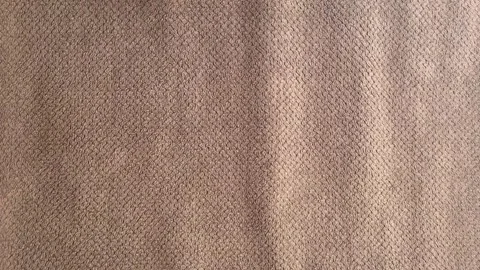 Close-up of Soft Brown Microfiber Fabric with Embossed Diamond Pattern Texture Stock Footage 340898330