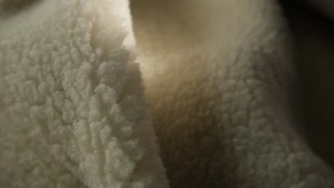 Close-up of Soft Cream-Colored Fleece Fabric Texture Stock Footage 296159566