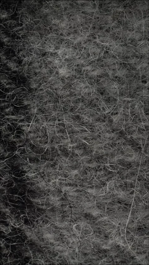 Close-up soft gray woolen shawl texture with curly fibers. Stock Footage 341530693