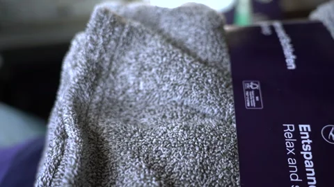 Close-up of a soft, lightweight polyester fleece blanket on Lufthansa flight Vídeo Stock 325761723