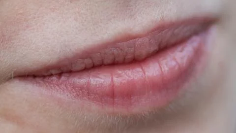 Close-up of soft, natural lips with subtle pink hue Stock Photos