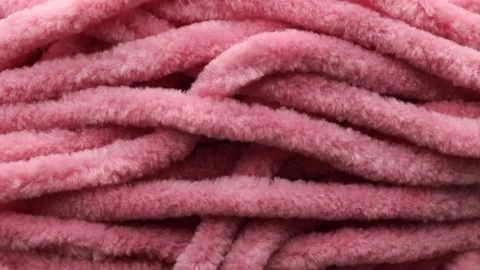 Close up of soft pink plush thread , rotation in circle. Stock Footage 234119617