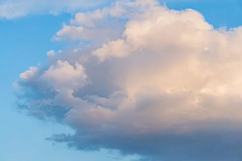 Close-up of soft, puffy cloud against a blue sky with scattered clouds White, Stock Photos