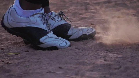 A close-up softball shoe dealing with the ground 스톡 동영상 143912465
