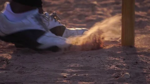 A close-up softball shoe dealing with the ground Stock Footage 143912532