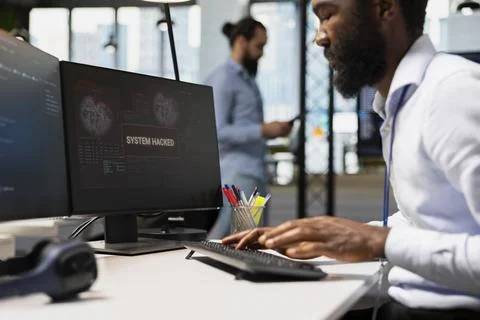 Close up of software developer blocking network intrusion inside office Stock Photos