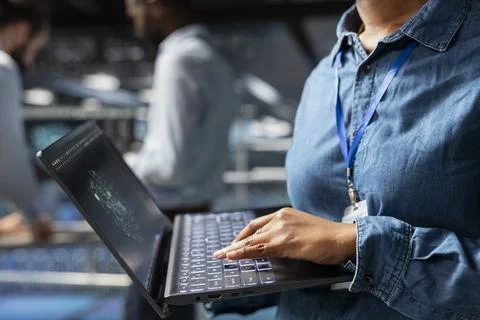 Close up of software developer performing servers maintenance with AI tools Stock Photos