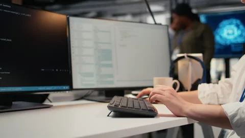 Close up of software developer typing on keyboard in office Stock Footage 322697613
