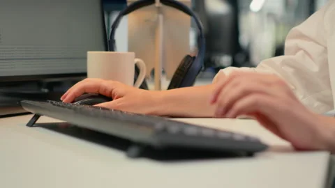 Close up of software developer typing on keyboard in office Stock Footage 323143279