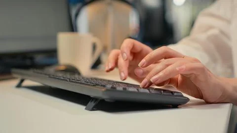 Close up of software developer typing on keyboard in office 스톡 사진