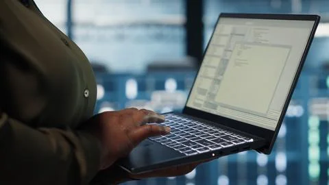 Close up of software developer working in data center to optimize network Stockfoto's