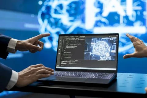Close up of software developers using AI code on laptop in tech startup Stock Photos