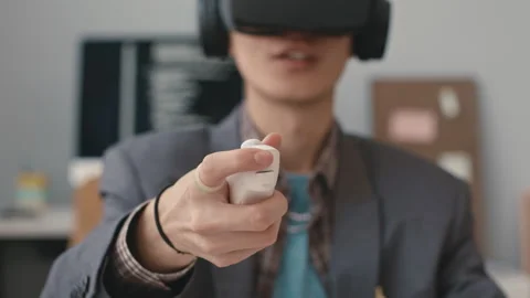 Close Up of Software Engineer Hand Holding VR Controller Stock Footage 241270584