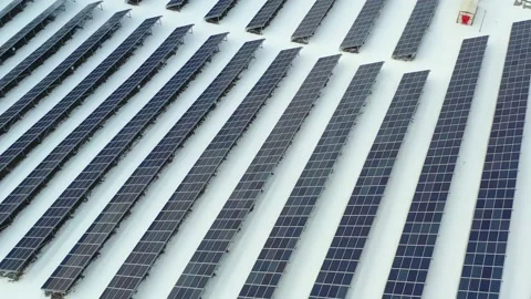 Close up  solar farm standing in rows of modern photovoltaic panels in at winter Stock Footage 169875584