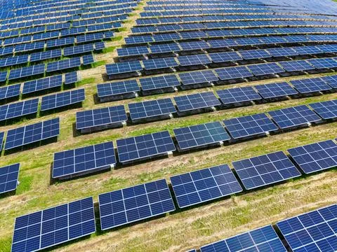 Close up solar panel patterns reflecting sunlight, glossy glass surfaces and  Stock Photos