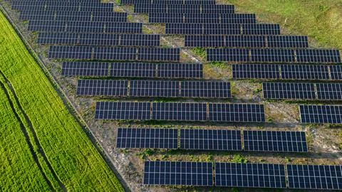 A close-up of solar panels reflecting the rays of Stock Photos