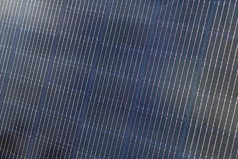 Close-up of solar panels with repeating rows of fine structures, possibly len 스톡 사진