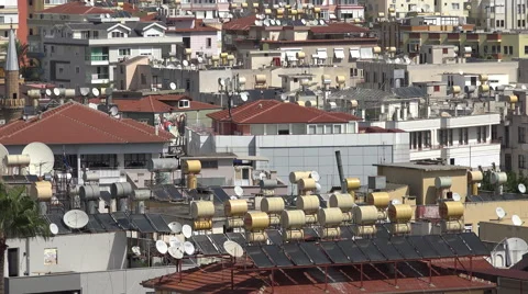 Close up of solar water heaters on rooftops, Alanya Stock Footage 44686390