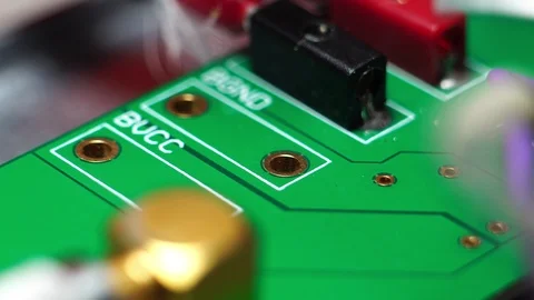Close up of soldering chip to board with iron  Vídeo Stock 125734502