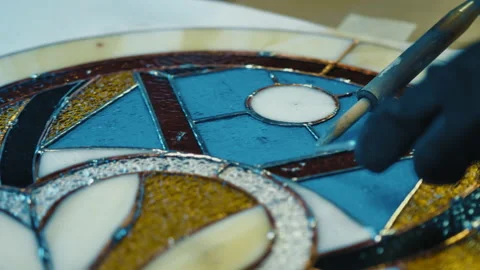 Close-up Soldering of stained glass seams. Stained glass workshop, needlework Stock-Footage 162780053