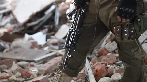 Close-up of a soldier in tactical gloves with an assault rifle Stock Footage 101805641