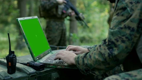 Close-up Soldier Uses Military Grade Laptop with Green Screen.  Stock Footage