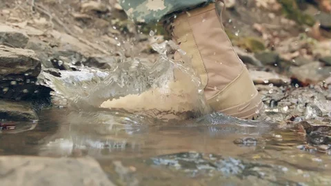 Close Up Of A Soldier's Boot Running Through Water Stock Footage 87430068