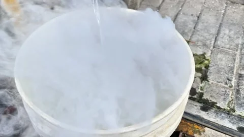 Close up of Solid Carbon Dioxide Sublimating in Liquid for Industrial Cooling Video stock 331568179