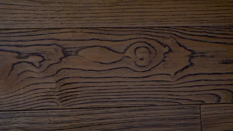Close-up solid wood floor walnut Board with beautiful texture, camera slide from Stock Footage 118818186