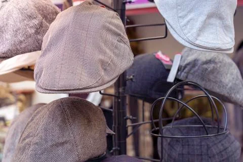 Close up of some caps on a clothe rack Stock Photos