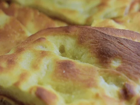 Close up of some  focaccia bread a typical italian bread Видео 69296302
