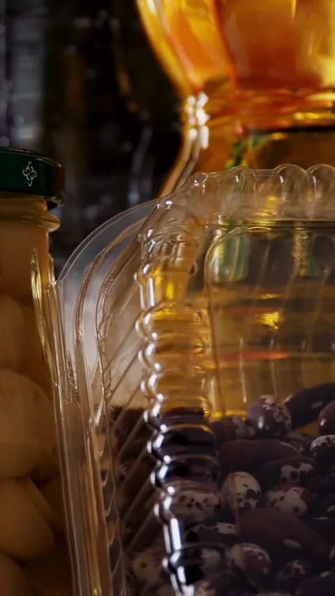 Close-up, some nicely arranged groceries, food products rotate on black Stock Footage 322115571