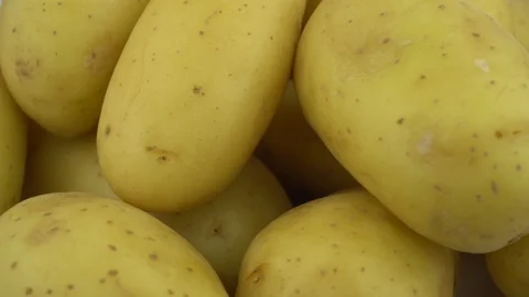 Close Up of some Potatoes on a Rotating plate Stock Footage 91829164
