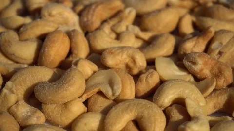 Close Up of some Salted Cashew Nuts Rotating, Macro, at Sunset Stock Footage 91268225
