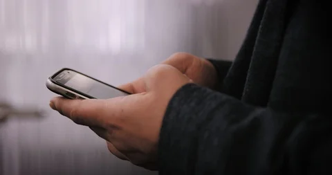 Close Up Of Someone Typing On Their Smartphone Stock Footage 128967363