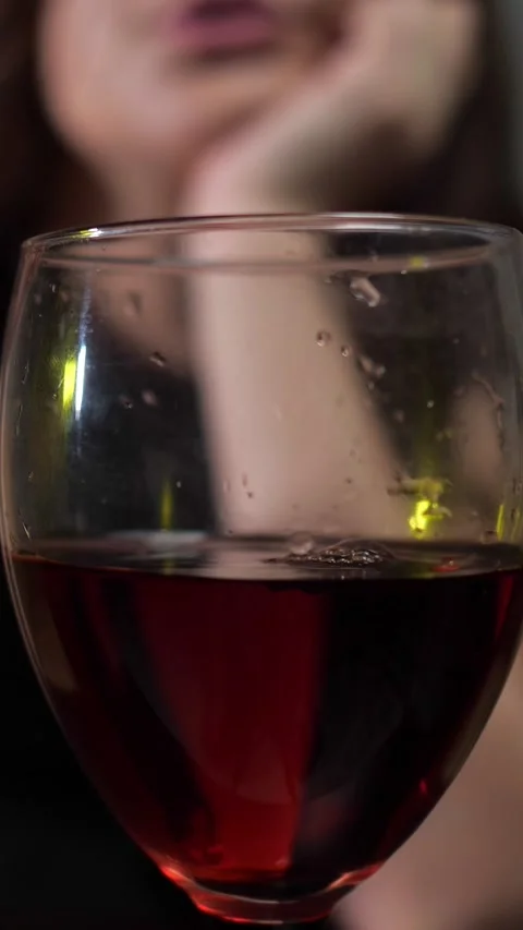 Close up of sommelier pouring red wine into glass for tasting at a party with a Vidéo 342908941