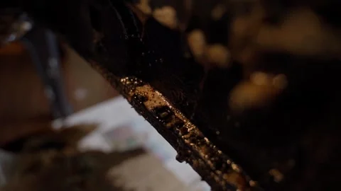 Close-up of soot cleaner dripping from the fireplace door Video stock 311565691