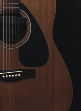Close up sound board and strings of old acoustic guitar and dark tone vintage Stock Photos